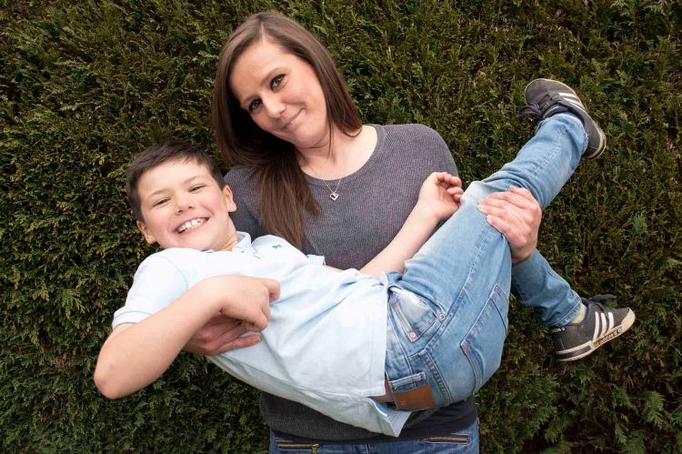 Mother picking up her son fun laughing natural family portrait outdoors | Michaela Howe Photography