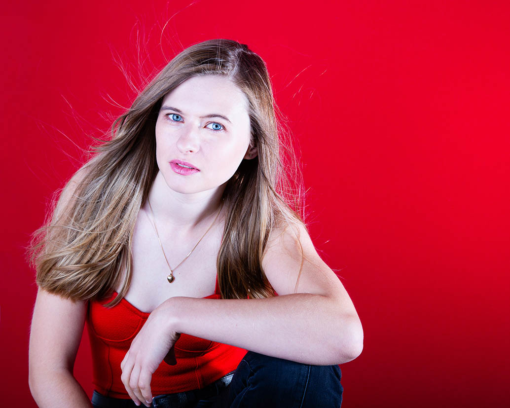 Lady on red background Glamour Portrait, blue eyes | Michaela Howe Photography